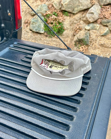 Gray cap with fish design on a truck bed