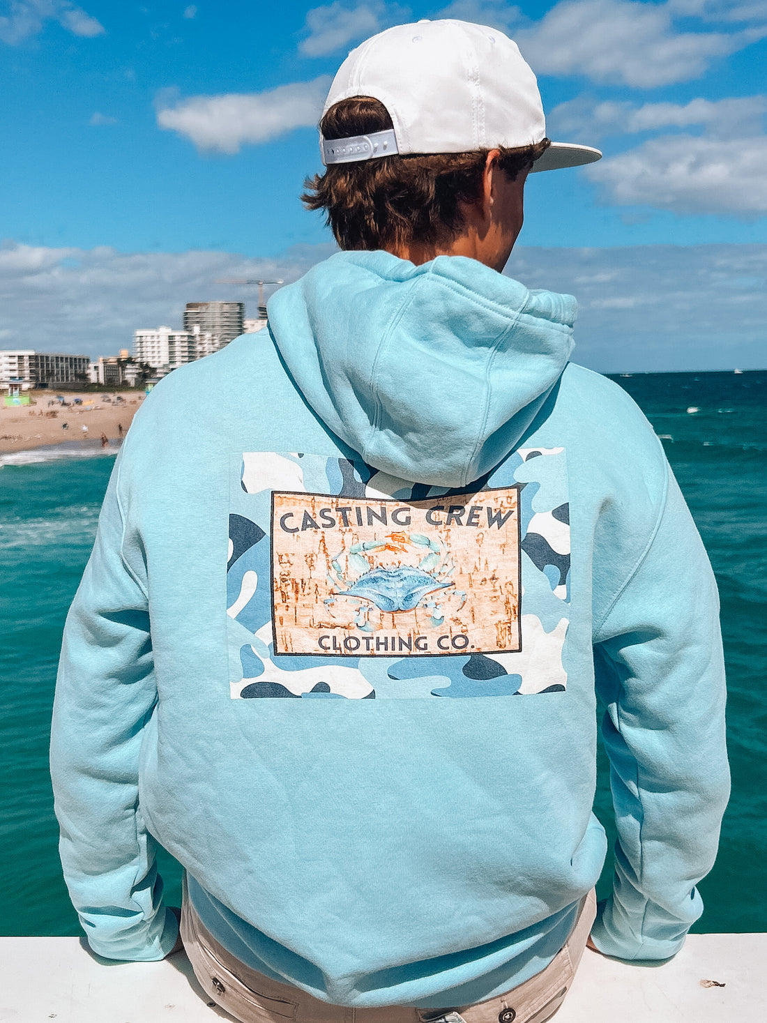 Blue Camo Crab fishing hoodie, On the fishing pier, back view